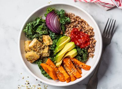 healthy lunch or dinner with avocado sweet potatoes tofu onion kale and lentils