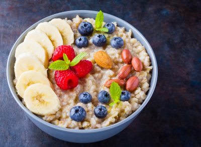 oatmeal with blueberries, bananas, and raspberries